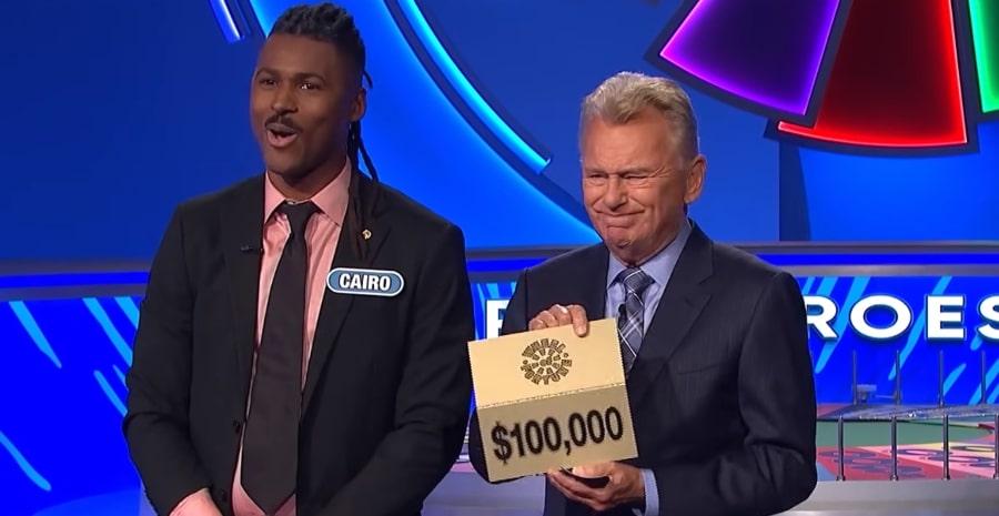 Pat Sajak winces at the sting of losing $100,000. - Wheel Of Fortune