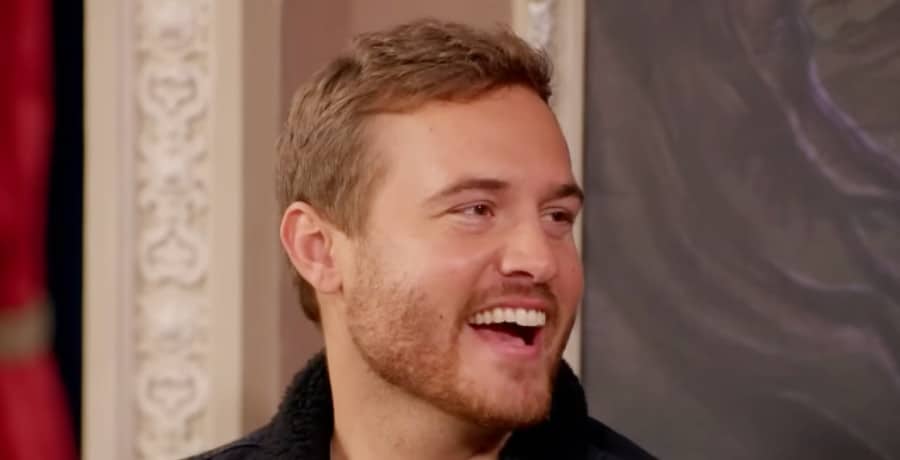 A man with short brown hair with a huge smile on his face.