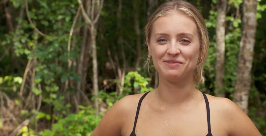 A woman with blonde hair in a jungle