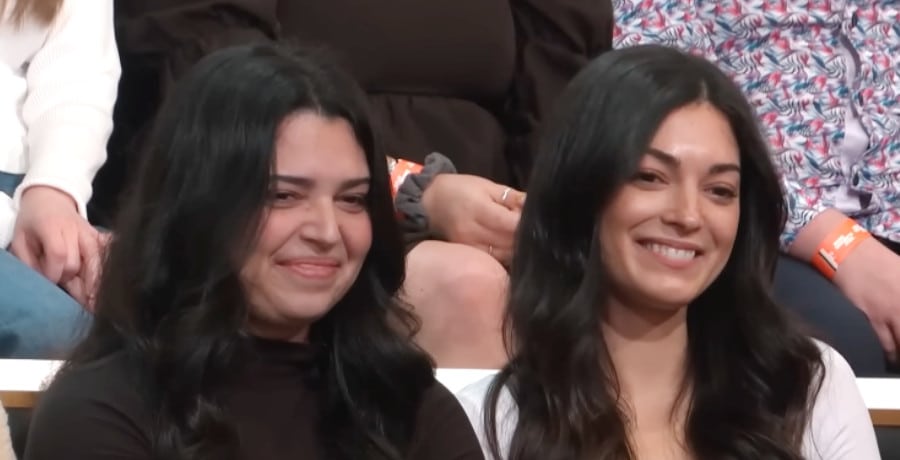 Two sisters, both with long black hair