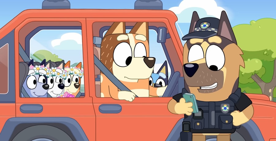 A police officer with Bluey and his family / YouTube