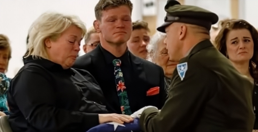 Janelle Brown Receives folded flag from the National Guard - Instagram via ET YouTube