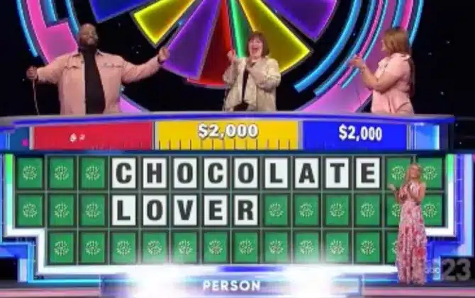 Pat Sajak gets a kick out of Larry dancing after solving the puzzle. - Wheel Of Fortune 
