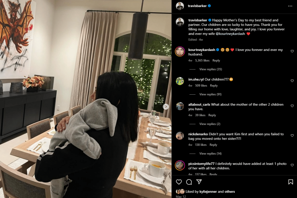 Kourtney Kardashian snuggles baby Rocky Thirteen. - Instagram
