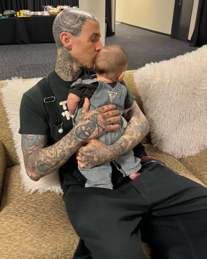 Travis Barker shows how big Rocky Thirteen is getting. - Instagram