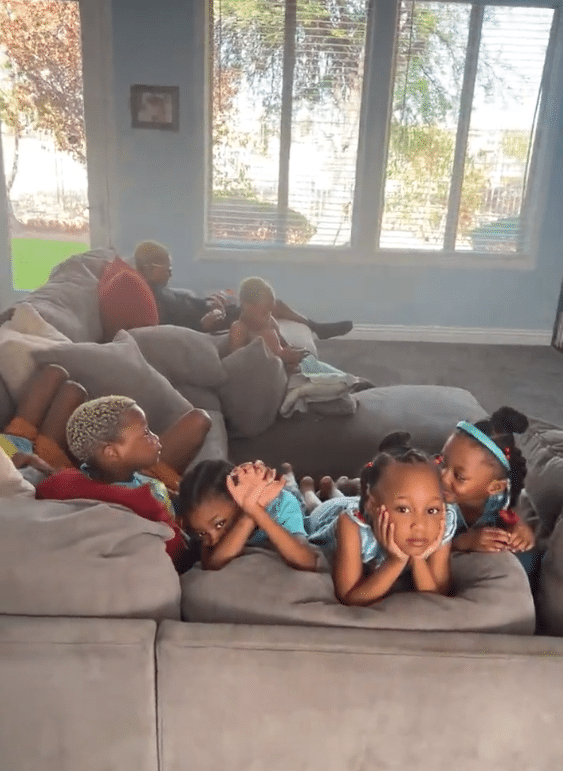 The Derrico kids watch their sisters perform for Amani. - Instagram
