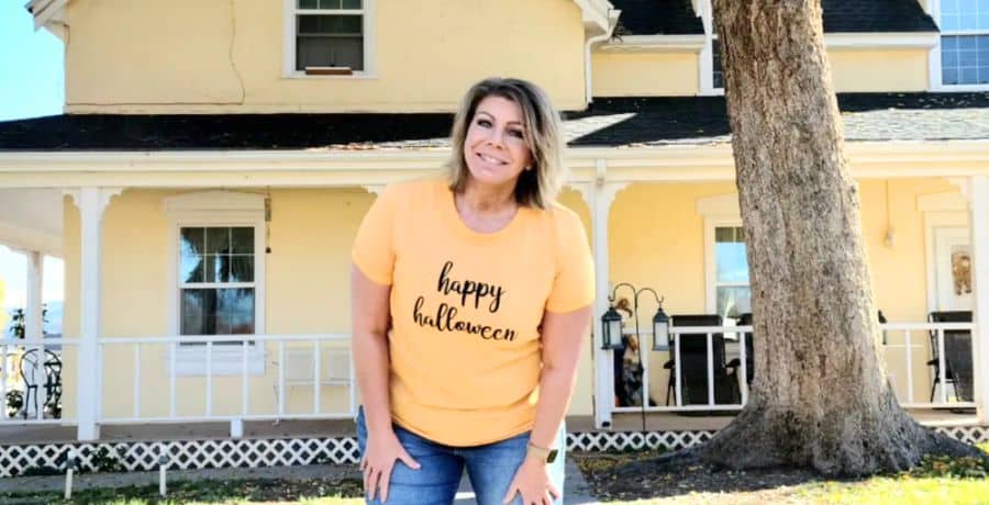 Meri Brown posing for a photo in front of her Utah bed & breakfast