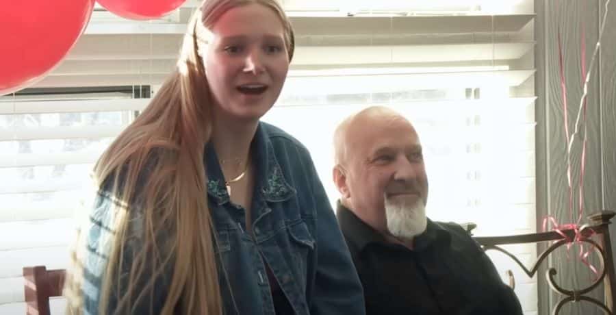 Ysabel Brown and David Woolley sitting together at family event