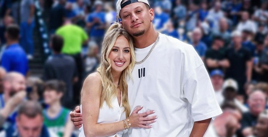 Patrick and Brittany Mahomes cuddle up at a basketball game