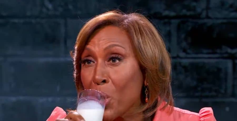 Robin Roberts drinking milk during Hot Ones interview