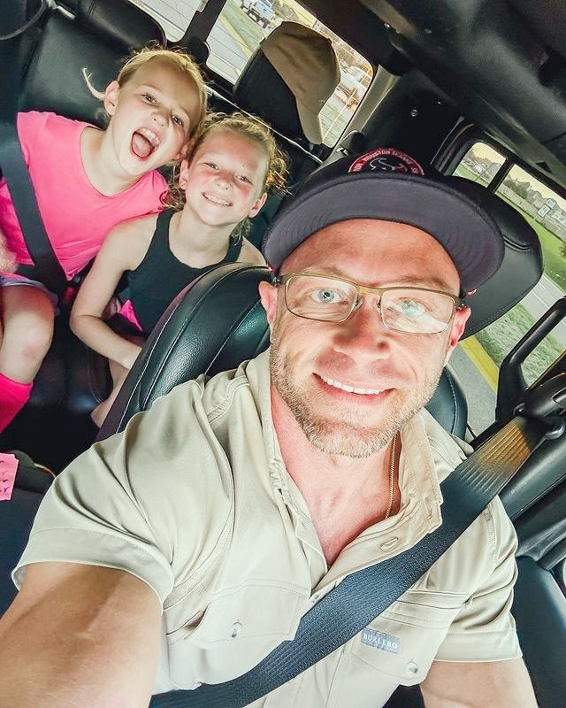 Adam Busby and two of his daughters from Instagram