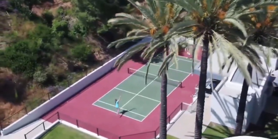 Kanye West's new tennis court that doubles as a basketball court. - X