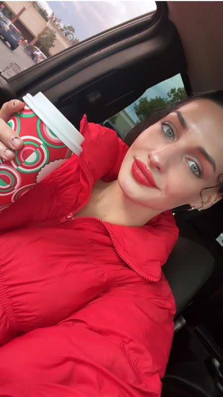 Moriah Plath shows her festive winter wear and coffee. - Instagram