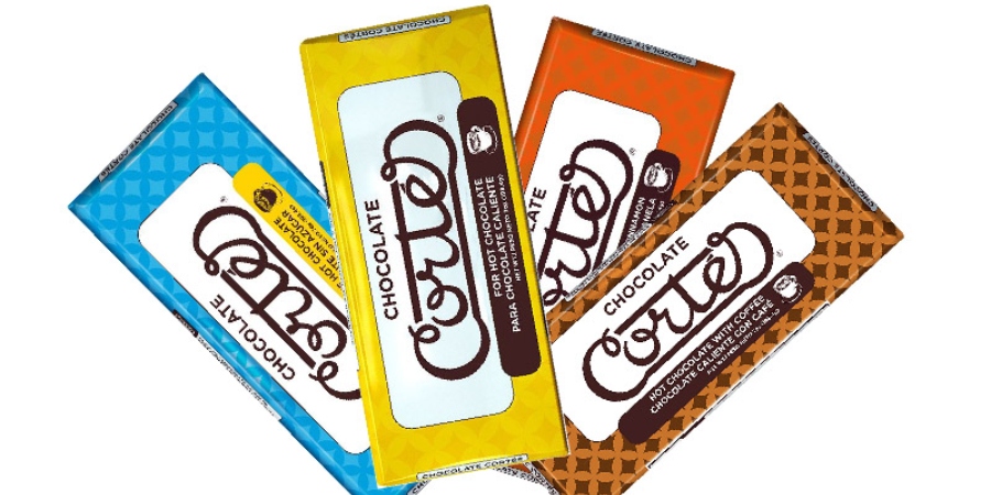 Whoopi Goldberg helps herself to the Chocobar Cortés coffee flavor.- Chocobar Cortés Website