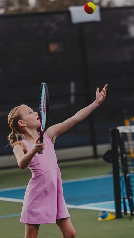 Adam catches great shots of Riley Busby making huge strides with learning tennis. - Instagram