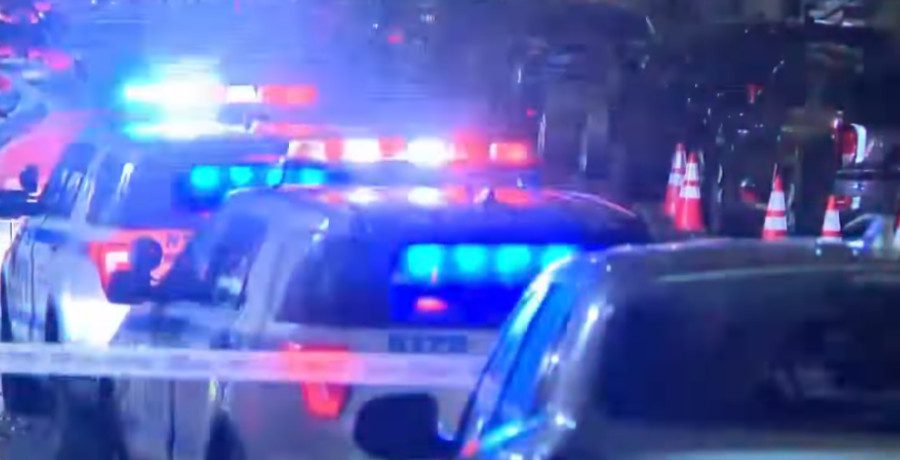 Cop cars outside stabbing in Harlem/Credit: YouTube