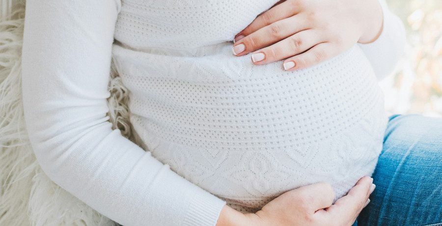A woman's pregnant belly/Credit: Unsplash