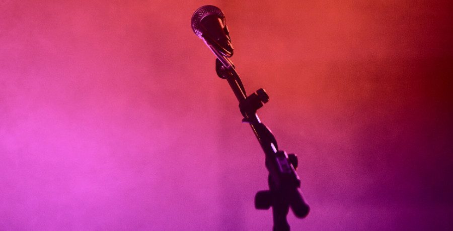 Stock photo of a microphone stand/Credit: Wikimedia Commons