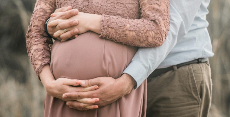 Stock photo of a man and his pregnant wife/Credit: Unsplash